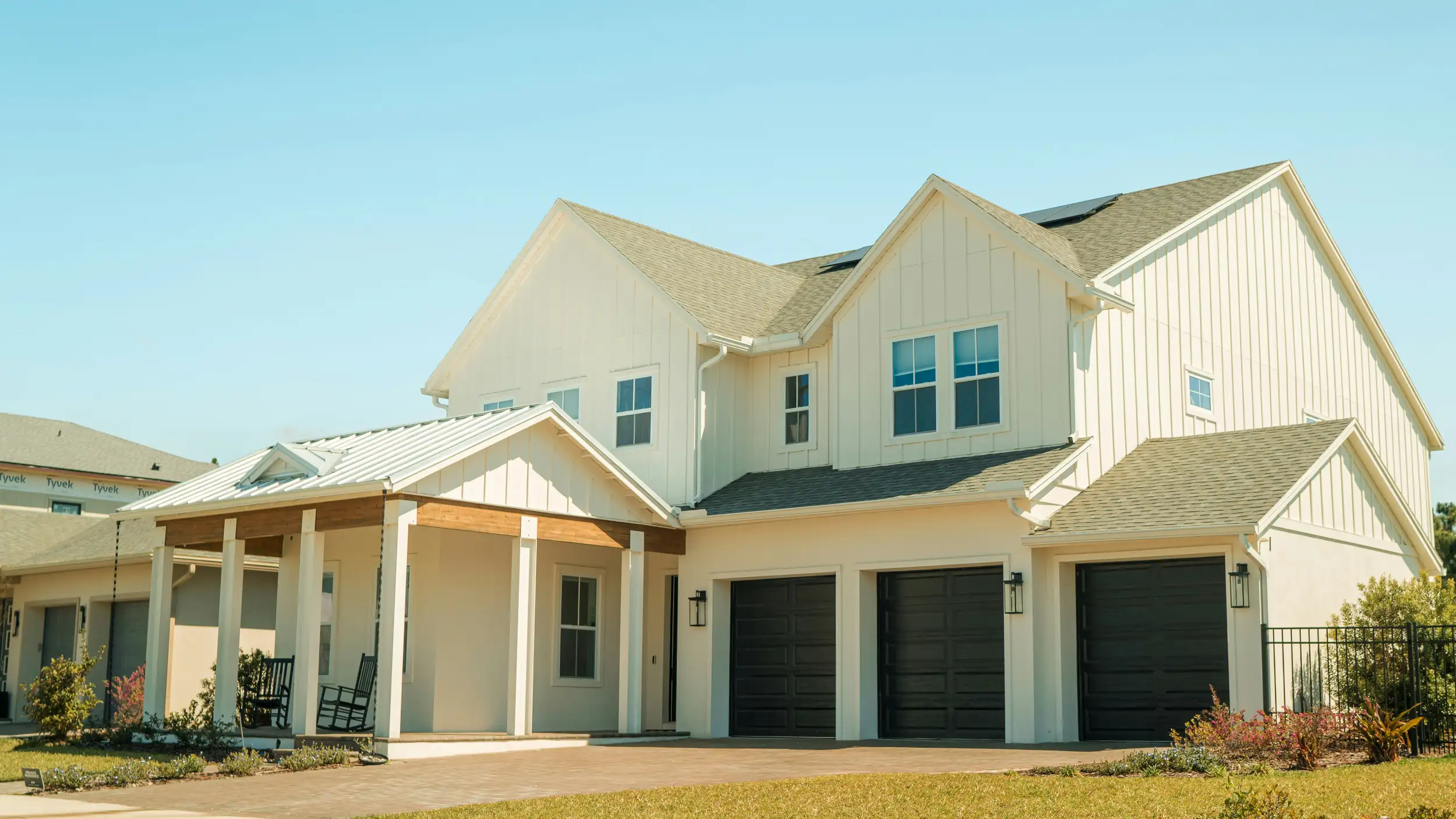 House front exterior with new white siding